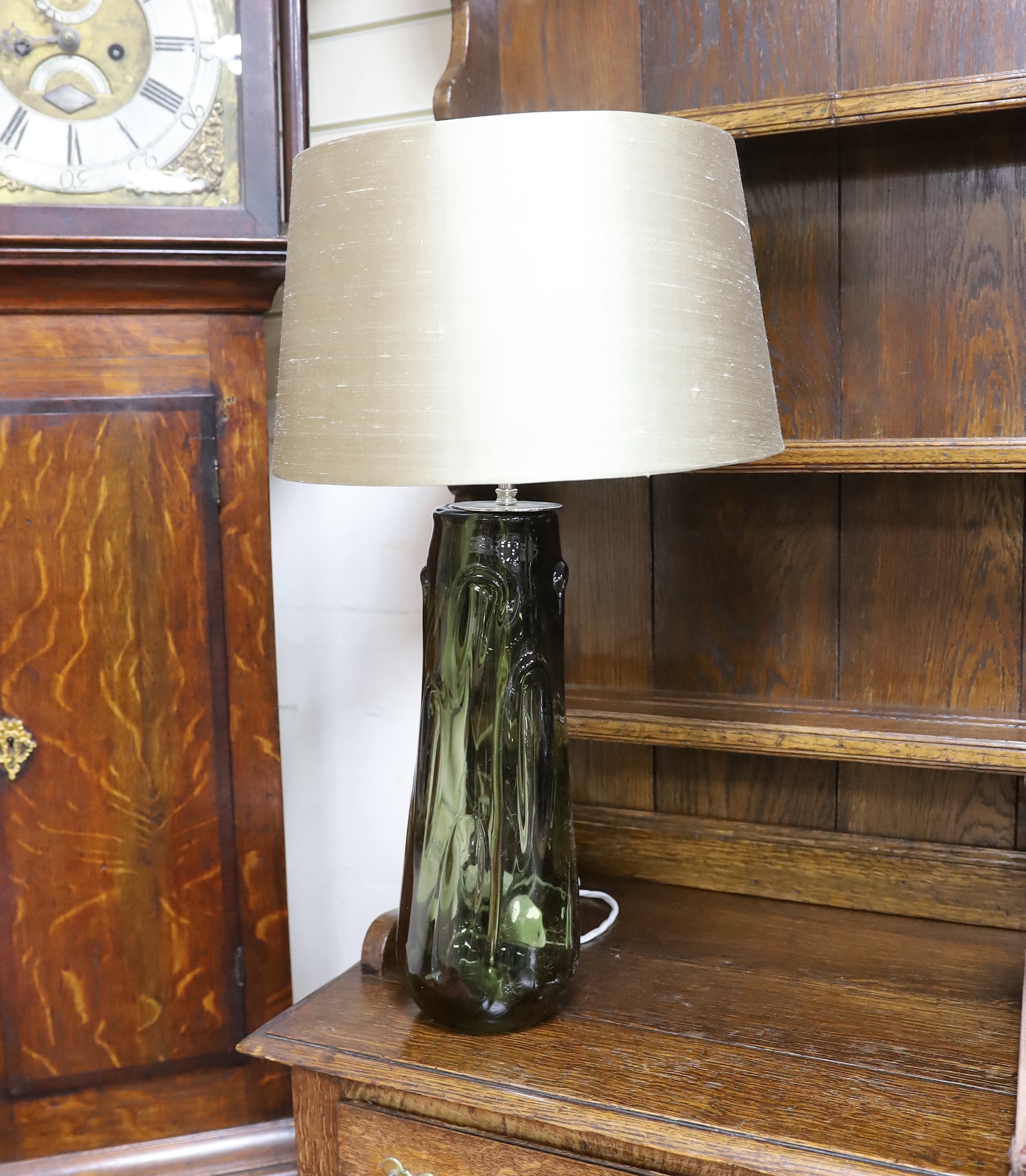 A pair of Whitefriars type green glass table lamps, 39cm high excluding light fitting